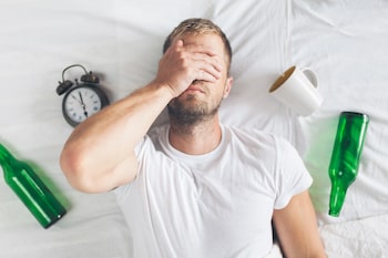 Caffeine and alcohol can make oversleeping worse.